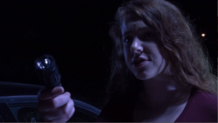 Rachel (Sierra Stodden) wields the "taser" she's going to use on her stepdad in "Clownado." (Screen capture from DVD by reviewer Ben Nagy)