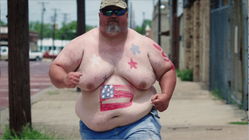 A big guy trains for the Freedomcake-eating contest in "American Zombieland." (Screen capture from DVD by reviewer Ben Nagy).