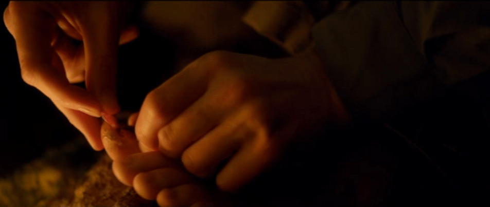 Ben Nagy reviews 'Backcountry': Some days you get away from the bear, and some days the bear gets you 5 Alex violates the Pedicurists' Code while sitting near the campfire in "Backcountry." (Screen capture by reviewer Ben Nagy)
