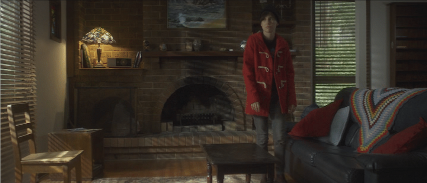 Ben Nagy reviews ‘Lost Gully Road’: Woman fleeing ex shacks up with a ghost in a cabin in the woods 2 Lucy (Adele Perovic) checks out the accommodations as she flees her ex in "Lost Gully Road." (Screen capture from DVD by reviewer Ben Nagy)